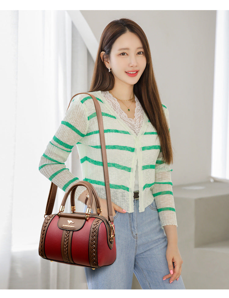 حقيبة بوسطن نسائية من جلد البقر وألوان متباينة